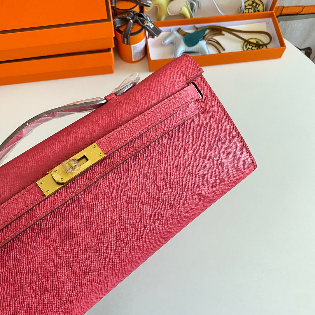 HERMES KELLY CUT 31 IN WATERMELON PINK CALFSKIN WITH GOLD HARDWARE