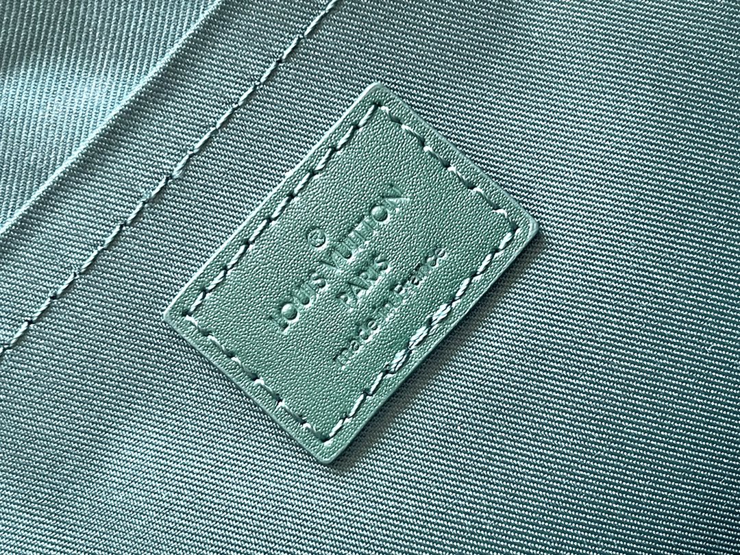 LOUIS VUITTON POCHETTE VOYAGE SOUPLE 32 IN GREEN MONOGRAM HERITAGE CANVAS